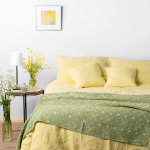Linen bedding in yellow color, washed: bed sheet, duvet cover and pillowcase. Produced in Lithuania