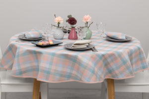Round linen tablecloth in pink, bluish, greenish, light gray checks. Produced in Lithuania